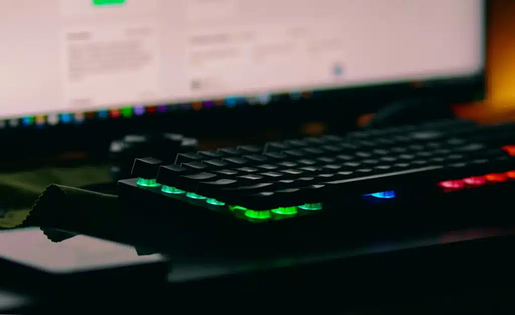 A computer keyboard sitting on top of a desk